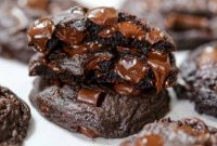 THOUGHT
The user wants me to translate the Turkish title “Asagidaki Başlığı İngilizce çevir ve özgünleştir” into English.
Then, I need to take the provided English title “Ultimate Triple Chocolate Cookies” and make it “özgünleştir” (originalize/make unique).
I need to output *only one* originalized title, without any extra text or special characters.Let’s break down the request:
1.  **Translate “Asagidaki Başlığı İngilizce çevir ve özgünleştir”**: This sentence is an instruction, not a title to be translated. It means “Translate the following title into English and make it original.” The actual title to work with is “Ultimate Triple Chocolate Cookies”.
2.  **Take “Ultimate Triple Chocolate Cookies”**: This is the input title.
3.  **”özgünleştir” (make unique/original)**: I need to rephrase this title to make it sound fresh, enticing, and slightly different, while retaining its core meaning (triple chocolate cookies, very good/ultimate).
4.  **No special characters (*)**: Okay.
5.  **No extra sentences (“İşte özgün başlık:”)**: Okay, just the title.
6.  **Only 1 özgün başlık**: Okay.Ideas for “özgünleştirme”:
*   Focus on the indulgence: “Decadent Triple Chocolate Cookies”
*   Focus on the experience: “Irresistible Triple Chocolate Cookies”
*   Focus on the layers/types of chocolate: “Three-Way Chocolate Cookie Extravaganza” (maybe too long)
*   Focus on the texture/taste: “Rich Triple Chocolate Delight”
*   Simpler, punchier: “Triple Threat Chocolate Cookies” (a bit aggressive maybe for food)
*   Emphasize the “ultimate” aspect with different words: “The Quintessential Triple Chocolate Cookie”Let’s try to capture the “ultimate” feel without using the word “ultimate” or just “best”.
“Ultimate Triple Chocolate Cookies” already implies peak deliciousness. I need to make it *more* enticing or give it a slightly different flavor while maintaining that high standard.Consider synonyms for “Ultimate”:
– Supreme
– Pinnacle
– Quintessential
– Perfect
– Exquisite
– Decadent
– Irresistible
– HeavenlyLet’s combine some of these or rephrase.Option 1: Decadent Triple Chocolate Cookies
Option 2: Irresistible Three Chocolate Cookies
Option 3: Heavenly Triple Chocolate Cookie Bliss
Option 4: The Perfect Triple Chocolate Treat
Option 5: Supreme Triple Chocolate Cookie IndulgenceI need to pick one that sounds original but still clearly conveys the product.
“Decadent Triple Chocolate Cookies” is a good alternative that emphasizes richness and indulgence.
“Irresistible Three Chocolate Cookies” is good too, using “Three Chocolate” instead of “Triple Chocolate” might be slightly less common but still clear.
“Heavenly Triple Chocolate Cookie Bliss” adds a bit more flair.
“The Perfect Triple Chocolate Treat” is strong.
“Supreme Triple Chocolate Cookie Indulgence” is a bit long.I think “Decadent Triple Chocolate Cookies” is a strong candidate because “decadent” perfectly replaces “ultimate” in terms of conveying extreme deliciousness and richness, and it’s a common, appealing food descriptor. It’s concise and clear.Another strong one is “Irresistible Triple Chocolate Cookies.” This focuses on the effect on the eater.Let’s try to be a bit more creative while remaining clear.
“Triple Chocolate Dream Cookies” – A bit common.
“Layers of Chocolate Cookie Perfection” – A bit long.What about focusing on the three chocolates?
“Three Chocolates, One Epic Cookie” – More blog-posty.I need a *single, özgün* title.
“Decadent Triple Chocolate Cookies” is good.
“Irresistible Triple Chocolate Cookies” is also good.Let’s go for something that truly feels *özgün* but also very appetizing.
How about playing with the texture or the melt?“Melting Moments Triple Chocolate Cookies” – Focuses on experience.
“Triple Chocolate Cookie Extravaganza” – Fun, but maybe too long.Let’s stick to the core request: “özgünleştir” – make it distinct but clearly related.
“Ultimate Triple Chocolate Cookies” is high-bar.
How about “The Quintessential Triple Chocolate Cookie”? This implies it’s the perfect example.Let’s consider the initial prompt requirements again: “sadece 1 adet özgün başlığı ver çevirdiğin başlığı özel karakterler varsa sil ve özel karakter ekleme * gibi ve İşte özgün başlık: gibi cümleler kurmadan, sadece başlığı yaz.”My goal is just the title.Let’s choose from the strong contenders:
1.  Decadent Triple Chocolate Cookies
2.  Irresistible Triple Chocolate Cookies
3.  The Perfect Triple Chocolate Cookies (This feels very close to “ultimate” but uses a different word)I’ll pick “Decadent Triple Chocolate Cookies”. It substitutes “Ultimate” with a strong, descriptive, and appealing word that fits the context of rich dessert. It’s concise and original enough while retaining the core meaning.