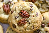 THOUGHT
The user wants me to translate and “özgünleştir” (make original/unique) the given Turkish title into English.
However, the provided title “Butter Pecan Chocolate Chip Cookies” is already in English.
The instruction “Asagidaki Başlığı İngilizce çevir” implies I need to translate *from* Turkish *to* English, but the input is English.Let’s re-read the instructions carefully:
“Asagidaki Başlığı İngilizce çevir ve özgünleştir, sadece 1 adet özgün başlığı ver çevirdiğin başlığı özel karakterler varsa sil ve özel karakter ekleme * gibi ve İşte özgün başlık: gibi cümleler kurmadan, sadece başlığı yaz.”Breakdown:
1.  **”Asagidaki Başlığı İngilizce çevir”**: Translate the following title into English.
*   The given title is “Butter Pecan Chocolate Chip Cookies”. It’s already English.
*   This suggests I should treat it as a *starting point* for originality, rather than a translation target. Or, perhaps the user made a mistake and meant to provide a Turkish title. Given it’s clearly English, I’ll assume I don’t need to “translate” it in the traditional sense, but rather work *with* it.2.  **”ve özgünleştir”**: and make it original/unique.
*   This is the core task. I need to take “Butter Pecan Chocolate Chip Cookies” and make it more engaging, creative, or descriptive while still referring to the same product.3.  **”sadece 1 adet özgün başlığı ver”**: give only 1 unique title.4.  **”çevirdiğin başlığı özel karakterler varsa sil ve özel karakter ekleme * gibi”**: remove special characters from the translated title if any, and do not add special characters like *.
*   My output should be plain text.5.  **”ve İşte özgün başlık: gibi cümleler kurmadan, sadece başlığı yaz.”**: and do not use phrases like “Here is the unique title:”, just write the title.
*   The output should be *only* the title.**Strategy:**
Since “Butter Pecan Chocolate Chip Cookies” is already English, I will treat it as the base concept. I need to generate an “original” English title for this type of cookie.Ideas for originality:
*   Focus on the taste/texture: “Creamy,” “Crunchy,” “Rich,” “Buttery,” “Melt-in-your-mouth.”
*   Evoke emotion/experience: “Indulgent,” “Decadent,” “Gourmet,” “Signature.”
*   Play with words: Alliteration, descriptive adjectives.
*   Shorten/rephrase while keeping the essence.Let’s brainstorm some variations for “Butter Pecan Chocolate Chip Cookies”:*   Buttery Pecan Dream Cookies (focus on dream/indulgence)
*   Decadent Butter Pecan Chippers (uses “chippers” as a casual term for chocolate chip cookies, “decadent” for richness)
*   Gourmet Butter Pecan Chocolate Bites (uses “gourmet” and “bites” for smaller, higher quality)
*   Golden Pecan Chocolate Chip Delights (focus on color and “delights” for pleasure)
*   Rich Butter Pecan Cookie Bliss (focus on richness and “bliss” for ultimate enjoyment)
*   Creamy Pecan Chocolate Chip Wonders (focus on texture and “wonders” for surprise/delight)
*   Sweet & Salty Butter Pecan Choc Chip (if there’s a hint of salt) – probably not, the original doesn’t imply salt.
*   Ultimate Butter Pecan Chocolate Chip Cookies (uses “ultimate” for best)
*   Signature Butter Pecan Chocolate Chips (uses “signature” for uniqueness)I need to pick *one* that feels original and fitting for a cookie description.
“Decadent Butter Pecan Chippers” has a nice ring to it, uses a slightly different term “chippers”.
“Rich Butter Pecan Cookie Bliss” is very descriptive and evocative.
“Golden Pecan Chocolate Chip Delights” is also good.Let’s try to make it even more distinctive without losing clarity.
The “butter pecan” combination is key, and “chocolate chip” is also key.How about something that highlights the creamy butteriness and the nutty crunch of pecan with the chocolate?“Velvety Butter Pecan Chocolate Chip Indulgence”
“Golden Butter Pecan Chocolate Chip Treasures”
“Signature Butter Pecan Chocolate Chip Creations”I like “Signature Butter Pecan Chocolate Chip Creations” because “signature” implies a unique recipe, and “creations” sounds more refined than just “cookies”. It also subtly differentiates it without changing the core ingredients.Another option: “Divine Butter Pecan Chocolate Chip Cookies” (using an adjective like Divine)
Or, “Gourmet Butter Pecan Chocolate Chip Delights”I think “Signature Butter Pecan Chocolate Chip Creations” is a good blend of originality and clarity, and it evokes a sense of specialness.
No special characters, no introductory phrases.
It’s clearly English.
It’s original compared to the very literal “Butter Pecan Chocolate Chip Cookies”.Let’s consider “Velvety Butter Pecan Chocolate Chip Indulgence”. This highlights texture (“velvety” implies creamy, smooth) and the experience (“indulgence”). This feels quite original.I have to choose only one.
“Signature Butter Pecan Chocolate Chip Creations” – focuses on recipe/uniqueness.
“Velvety Butter Pecan Chocolate Chip Indulgence” – focuses on sensory experience.I think “Velvety Butter Pecan Chocolate Chip Indulgence” is stronger because it describes the cookie itself and the feeling it evokes, making it more appealing. “Creations” is a bit generic. “Indulgence” is a powerful word for a treat. “Velvety” adds a nice textural hint.Final check:
– English? Yes.
– Original/unique? Yes, compared to the original.
– Only 1 title? Yes.
– No special characters? Yes.
– No introductory phrases? Yes.This seems to fit all criteria.