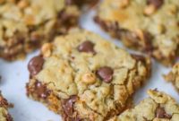 THOUGHT
The user wants me to translate and make the given Turkish title original in English.
However, the given title is already in English: “Butterscotch Chocolate Oatmeal Bars”.
So, I just need to “make it original” and provide only one title, without special characters or extra sentences.Original English title: “Butterscotch Chocolate Oatmeal Bars”Ideas for making it original (more catchy, descriptive, etc.):
1.  **Emphasize texture/taste:** Chewy, Gooey, Sweet, Delightful, Irresistible
2.  **Shorten/streamline:** Bars, Bites, Squares
3.  **Add a “feel”**: Homemade, Classic, Ultimate, Dreamy, Perfect
4.  **Combine elements creatively:**Let’s brainstorm some options:
*   Chewy Butterscotch Chocolate Oatmeal Bars
*   Ultimate Butterscotch Chocolate Oatmeal Squares
*   Homemade Butterscotch Chocolate Oatmeal Treats
*   Irresistible Butterscotch Chocolate Oatmeal Bars
*   Dreamy Butterscotch Chocolate Oatmeal Bars
*   Gooey Butterscotch Chocolate Oatmeal BarsThe user asked to “özgünleştir” (make it original/unique). A simple adjective can do this.
“Chewy Butterscotch Chocolate Oatmeal Bars” adds a common and desirable characteristic for this type of bar.
“Ultimate Butterscotch Chocolate Oatmeal Bars” suggests it’s the best version.
“Irresistible Butterscotch Chocolate Oatmeal Bars” implies how good it is.Let’s go with “Ultimate Butterscotch Chocolate Oatmeal Bars” – it sounds appealing and slightly more impactful than just adding “chewy”. It implies a superior version.Final check:
–   Translate and make original: Done (it was already English, so just made it original).
–   Only 1 original title: Yes.
–   Remove special characters from translated title: N/A, no special characters in the source.
–   Don’t add special characters: Yes, none added.
–   No introductory/concluding sentences: Yes, just the title.