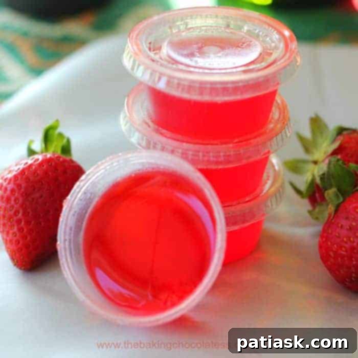 Delicious Strawberry Lime Margarita Jello Shots ready for a party