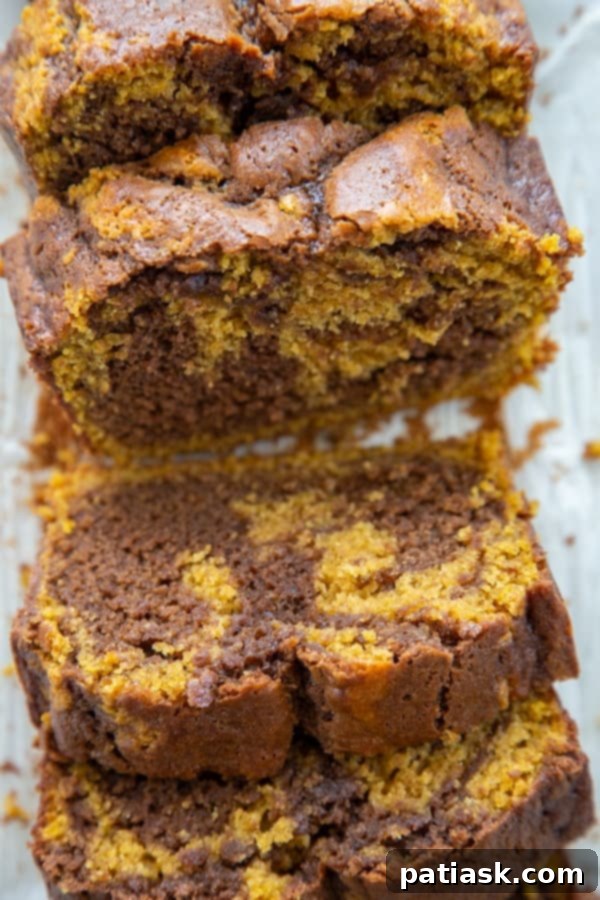 20 Pumpkin Bread Masterpieces for Autumn 13 Moist pumpkin bread swirled with decadent Nutella, combining rich fall flavors.