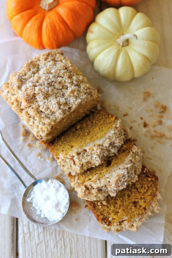 20 Pumpkin Bread Masterpieces for Autumn 14 Delicious crumbly pumpkin bread with a golden streusel topping, a perfect fall indulgence.