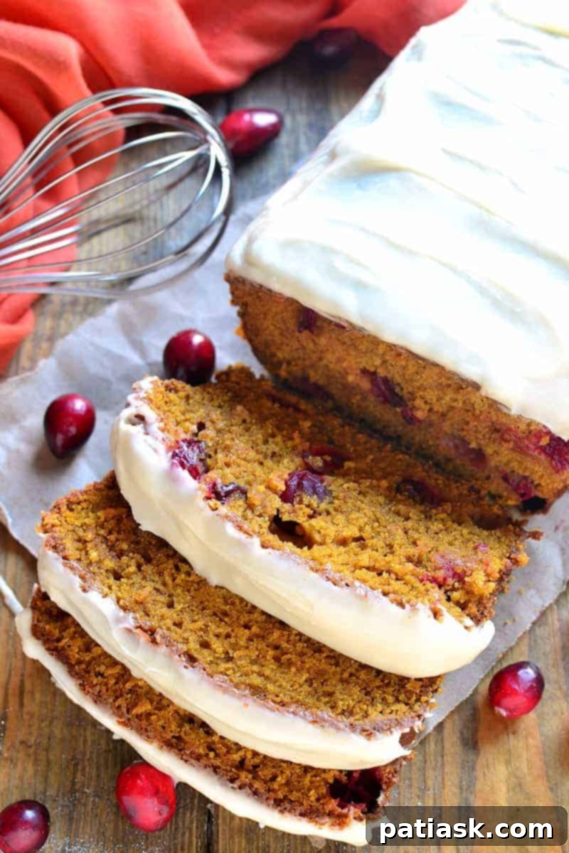 20 Pumpkin Bread Masterpieces for Autumn 18 Moist cranberry pumpkin bread topped with sweet cream cheese icing, perfect for fall holidays.