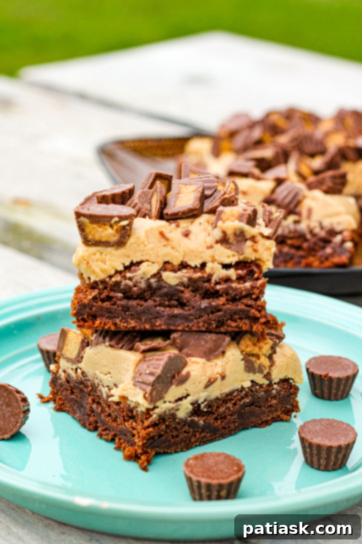 Decadent Reese's Peanut Butter Brownies 3 Stack of Reese's Peanut Butter Cup Brownies with a rich peanut butter buttercream frosting.