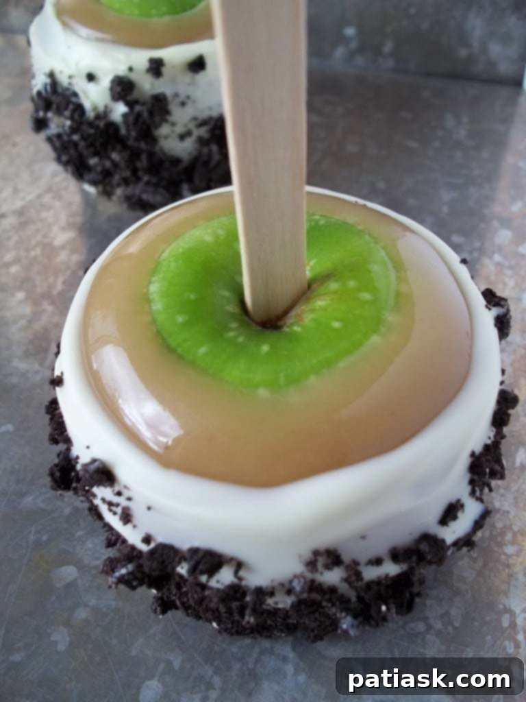 Ultimate Caramel Apples with Cookies and Cream Topping