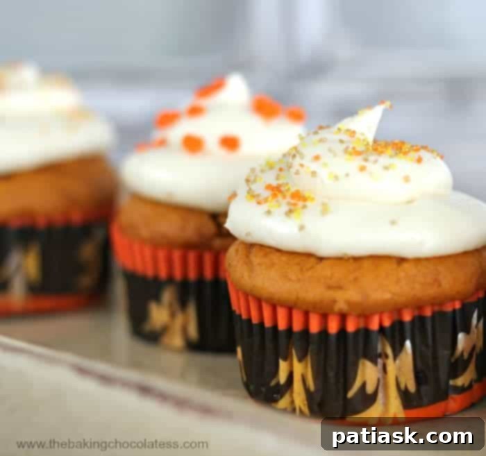 Plush Pumpkin Cupcakes with Vanilla Cream Cheese Frosting - a delightful autumn treat
