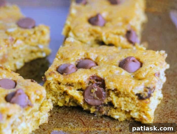 Stacked Soft Pumpkin Chocolate Chip Bars, ready to be enjoyed as a fall dessert