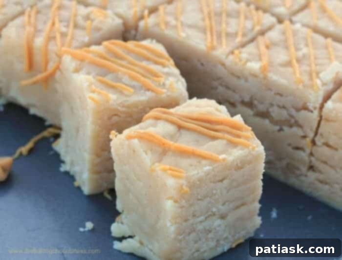 No-Fuss Peanut Butter Fudge 3 Soft & Creamy Peanut Butter Fudge pieces, perfectly cut and ready to serve.