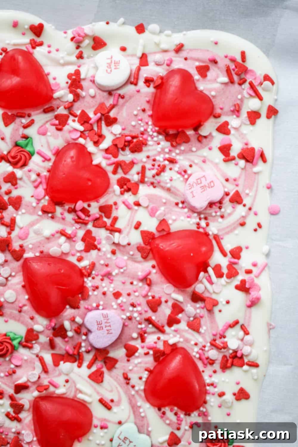 Valentine's Day Chocolate Bark 2 Easy Valentine Chocolate Bark with festive sprinkles and pink swirls