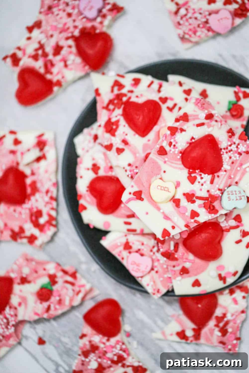 Valentine's Day Chocolate Bark 3 Easy Valentine Chocolate Bark with a delicate pink swirl and assorted candies