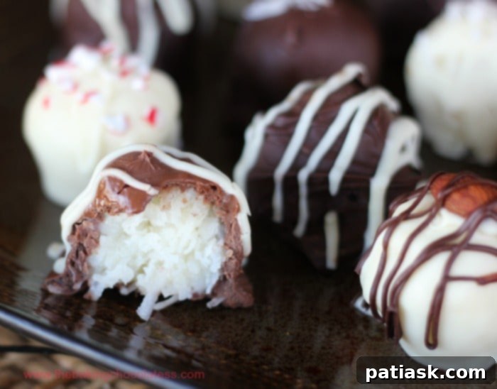 Irresistible Chocolate Covered Coconut Truffles on a serving platter