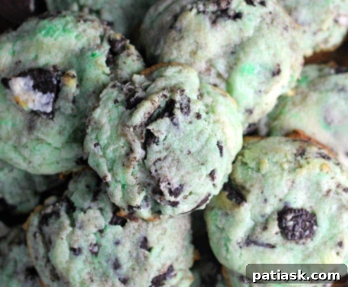 Cookie dough for Holiday Oreo Cream Cheese Cookies with crushed Oreos being mixed