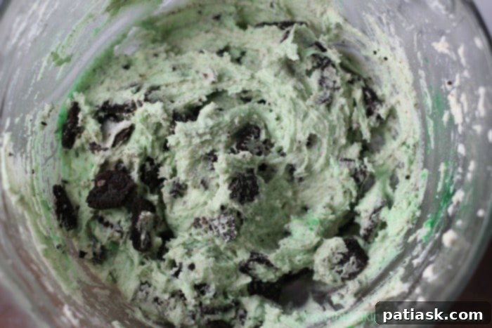 Freshly baked Holiday Oreo Cream Cheese Cookies cooling on a rack