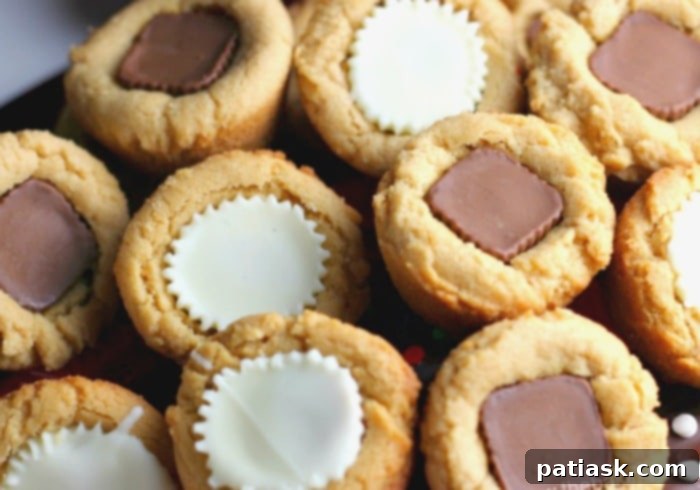 Decadent Peanut Butter Cookie Cups 3 Close-up of baked peanut butter cookie cups with Reese's