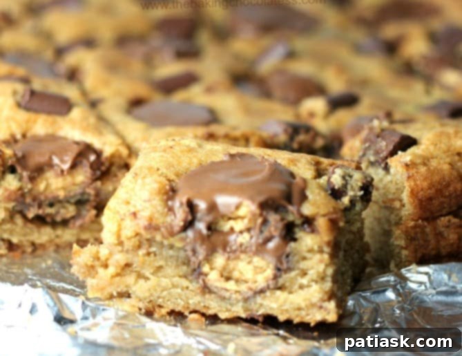 Chunky Monkey Peanut Butter Cup Banana Blondies cut into squares