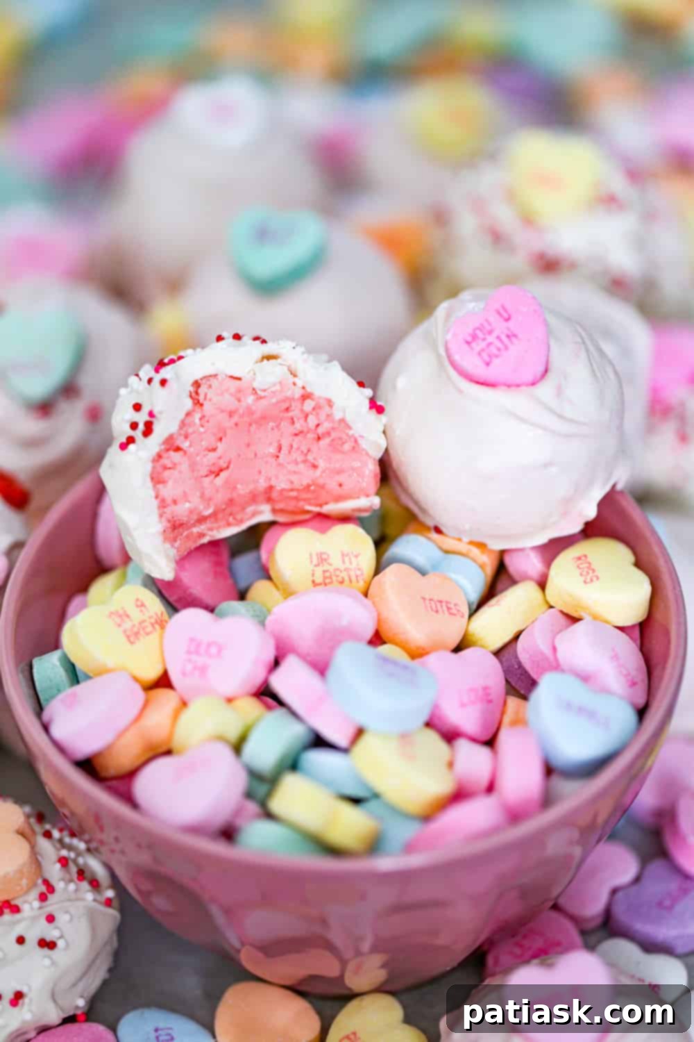 Melt Hearts: 20 Homemade Valentine Chocolate Recipes 7 Vibrant Valentine Candy Strawberry Cream Jello Truffles decorated with conversation hearts.
