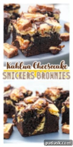 Two Kahlua Cheesecake Snickers Brownies, standing upright to show their decadent layers