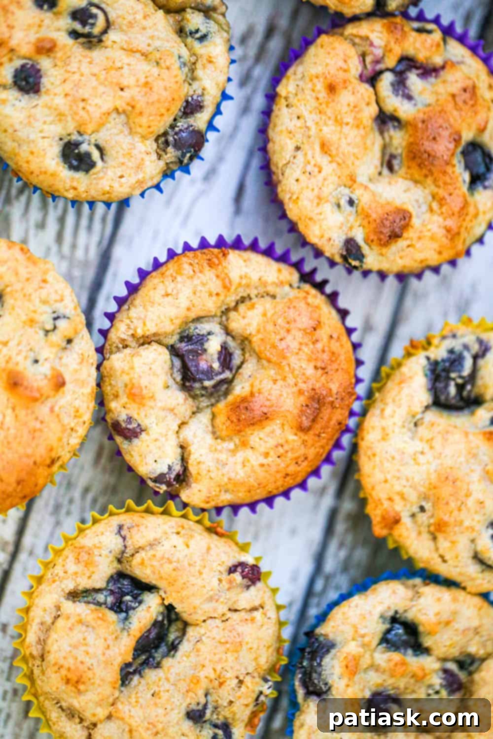 Homemade sugar-free blueberry muffins cooling on a rack