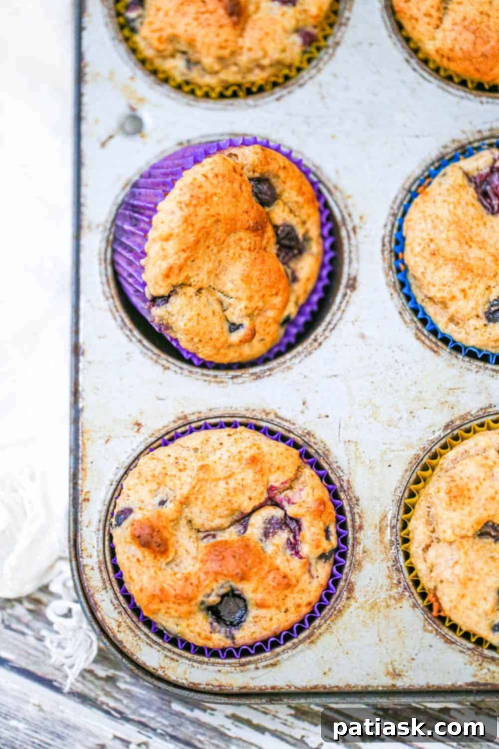 A batch of healthy blueberry muffins with a light glaze