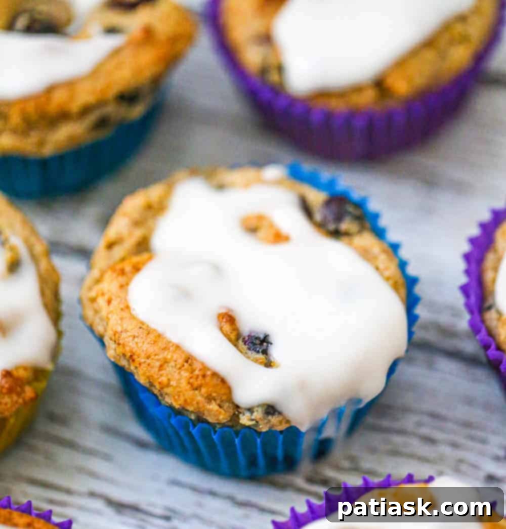 Healthy Blueberry Muffins with a drizzle of glaze