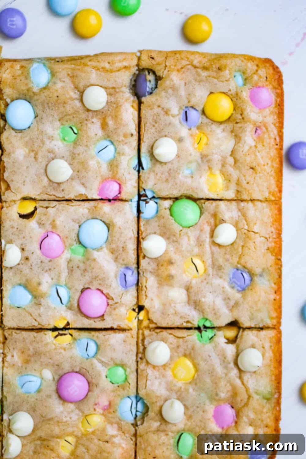 Springtime M&M Chocolate Chip Blondie Bars 3 Easy M&M blondie bar recipe with white chocolate chips for Easter