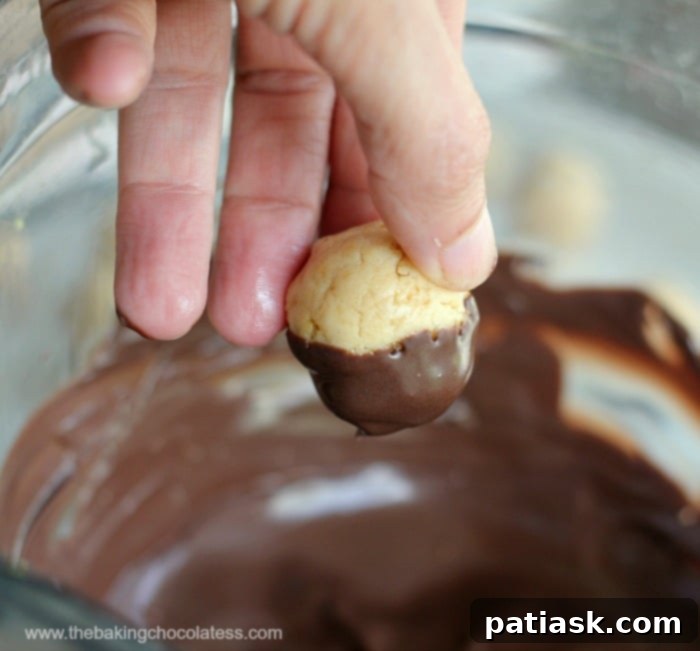Golden Oreo Cupcake Truffles 7 dipping base of Mini Cupcake Golden Oreo Cookie Balls in chocolate
