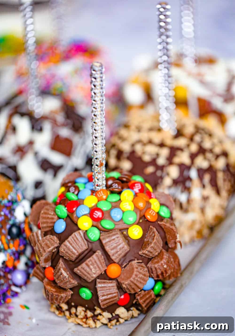 20 Hauntingly Delicious Halloween Treats 13 Blinged Out Caramel Apples covered in chocolate and toppings.