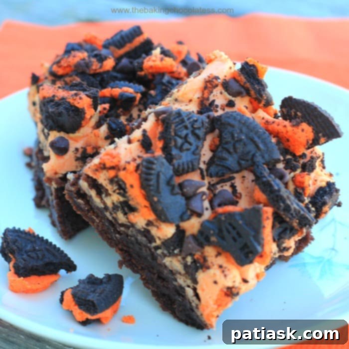 20 Hauntingly Delicious Halloween Treats 17 Orange Butter’Scream’ OREO Brownies with orange frosting and Oreo pieces.