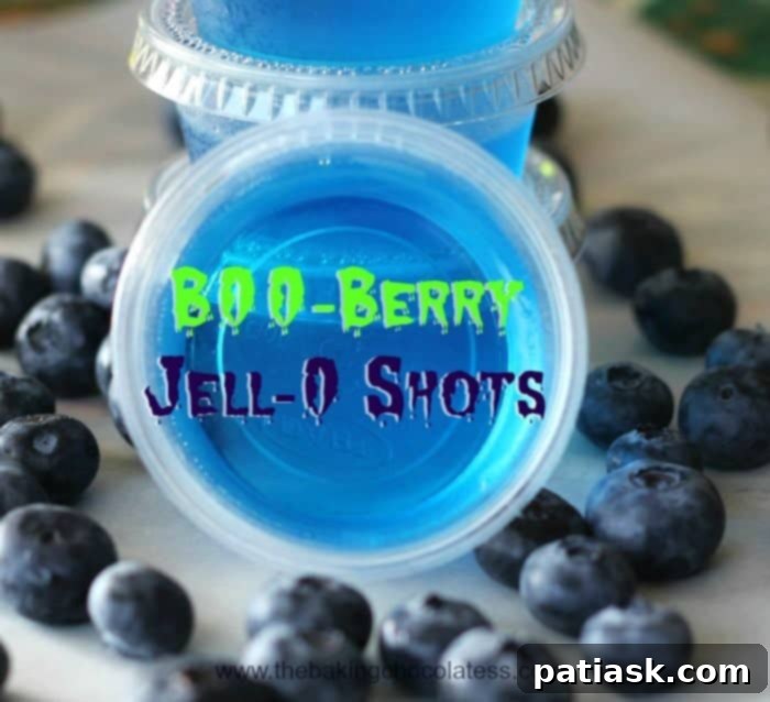 20 Hauntingly Delicious Halloween Treats 18 B00-Berry Jell-O Shots in a vibrant blue color.
