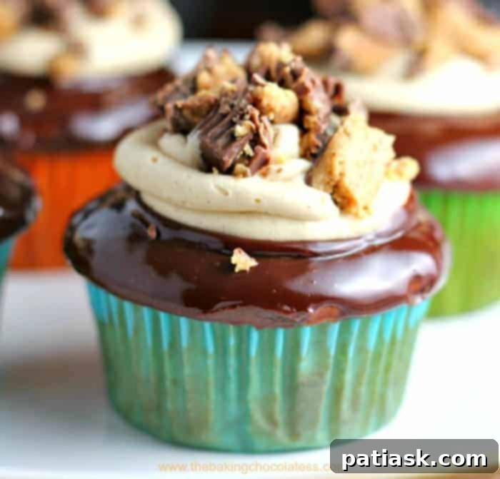 20 Hauntingly Delicious Halloween Treats 22 Double Stuffed Peanut Butter Cup Bliss Cupcakes with chocolate frosting.