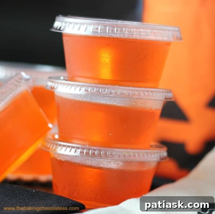 20 Hauntingly Delicious Halloween Treats 5 Orange Creamsicle Jell-O shots in small cups.
