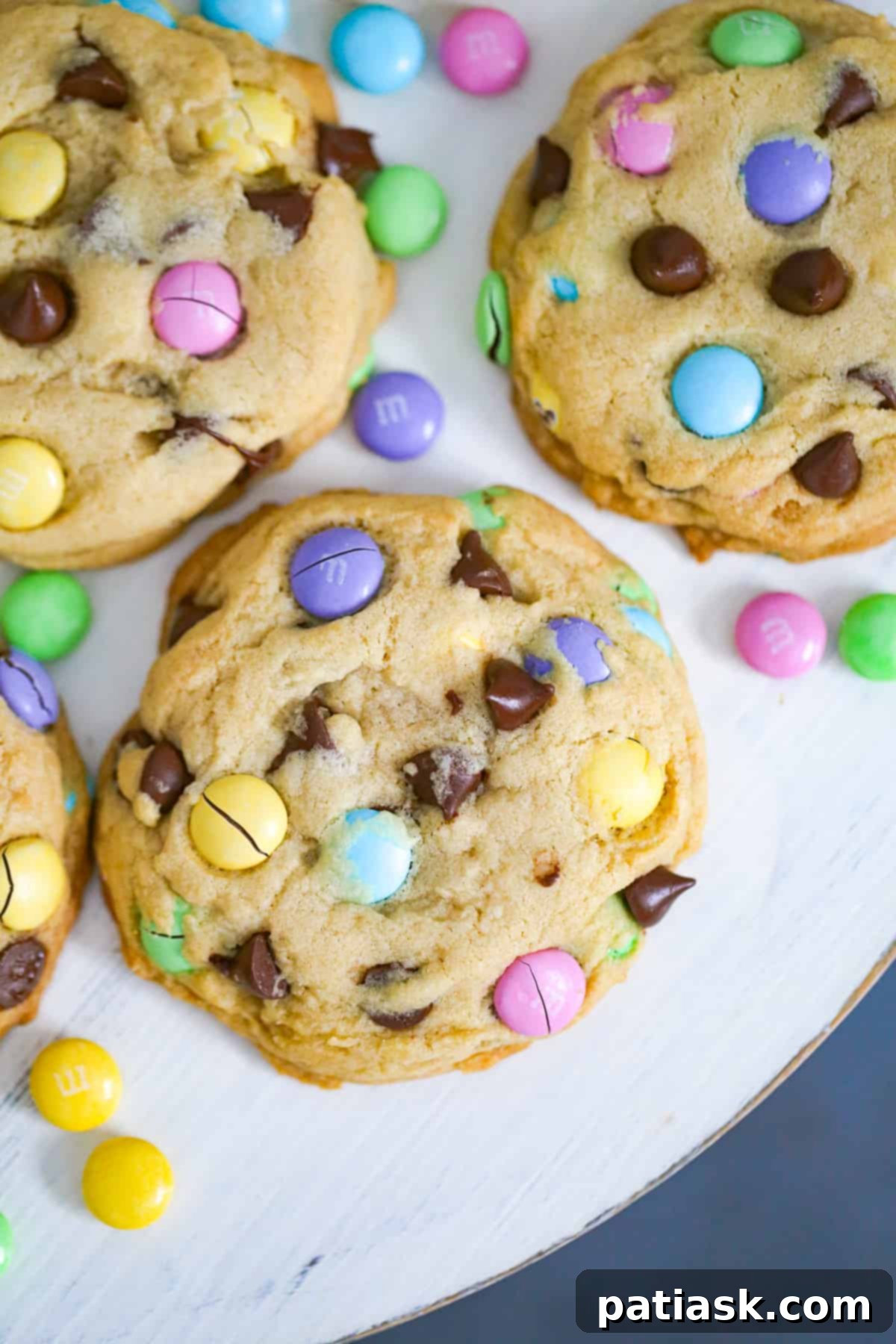 Overhead shot of Spring M&M Chocolate Chip Cookies on a marble surface