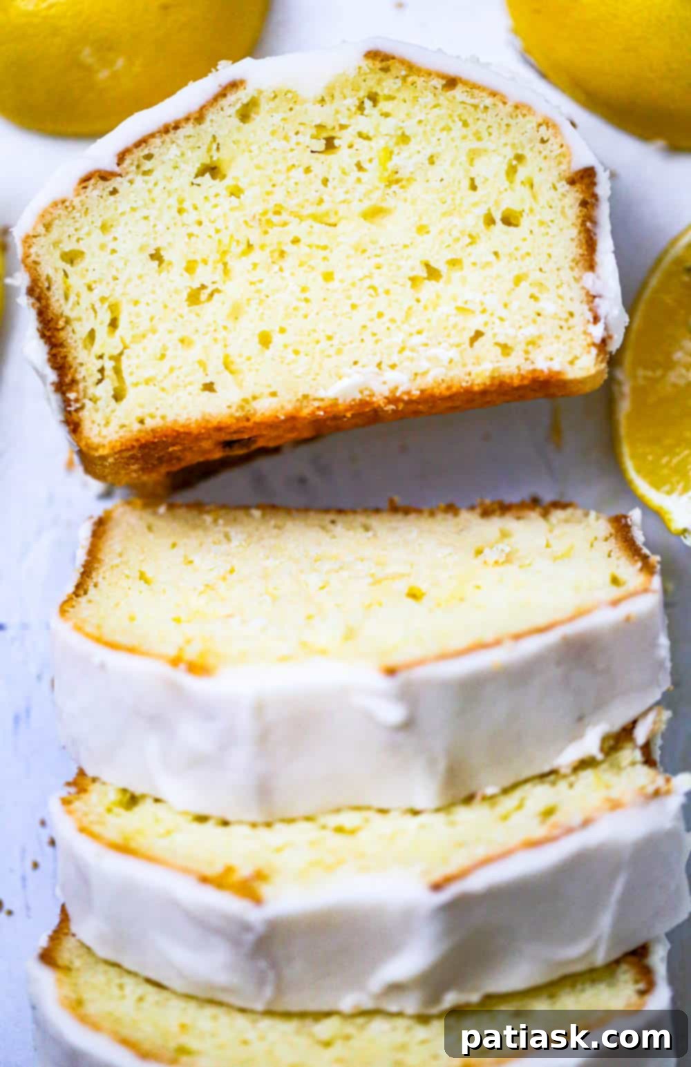 Starbucks-Inspired Glazed Lemon Loaf 8 Starbucks CopyCat Lemon Loaf - easy lemon loaf recipe - A stack of perfectly sliced lemon loaf pieces, glistening with glaze.