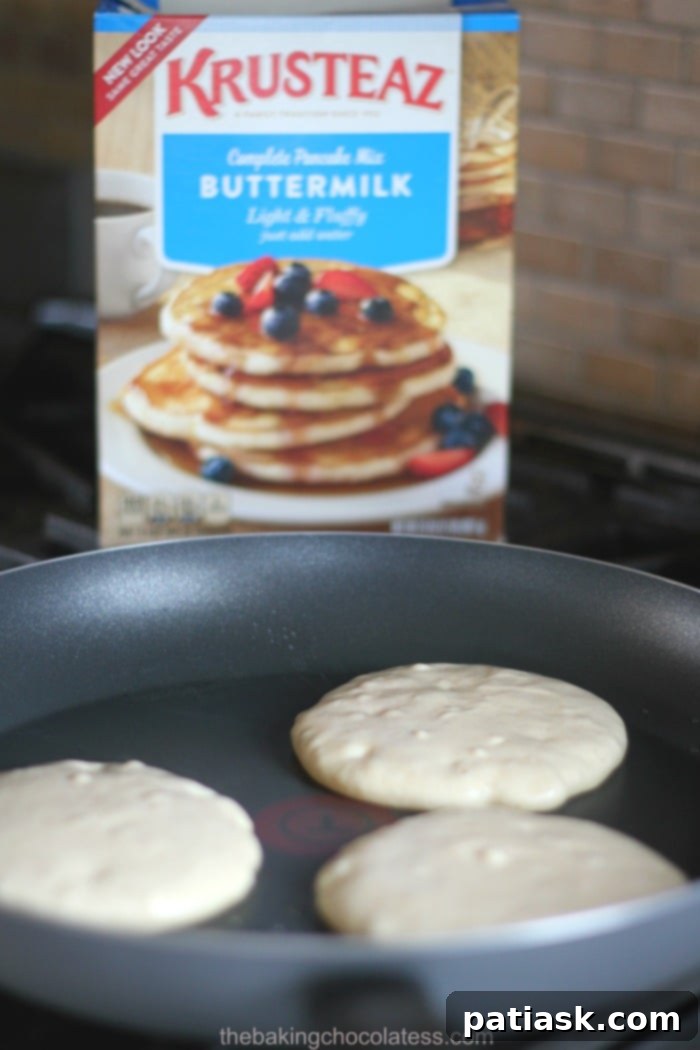 Krusteaz: Make Every Dinner Breakfast This Month 7 A Stack of Delicious Peanut Butter Pancakes with Syrup