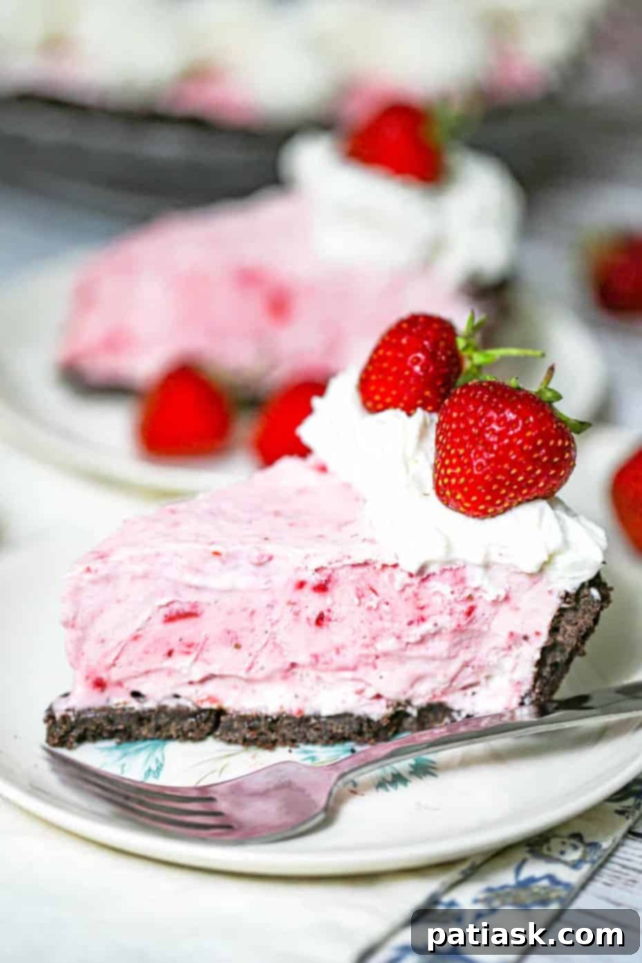 Strawberry Dream Cheesecake 4 Frozen strawberries cheesecake slice on a plate