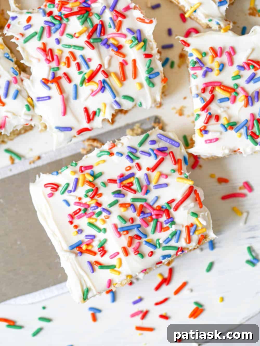 Effortless Gluten-Free Sugar Cookie Bars 7 Three Gluten-Free Sugar Cookie Bars on a white plate