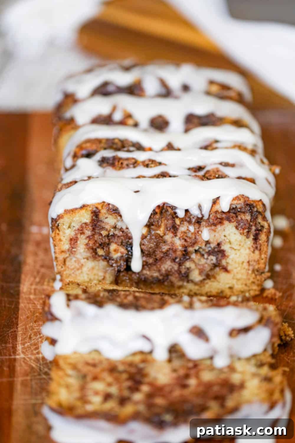 Spiced Apple Cinnamon Bread 2 Delicious apple cinnamon bread with a vanilla glaze, perfect for fall baking.