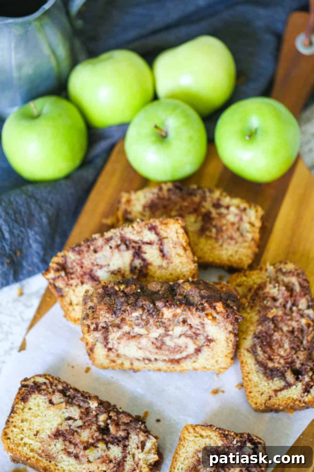 Spiced Apple Cinnamon Bread 4 Close-up of cinnamon bread with apples and glaze, showcasing the texture.