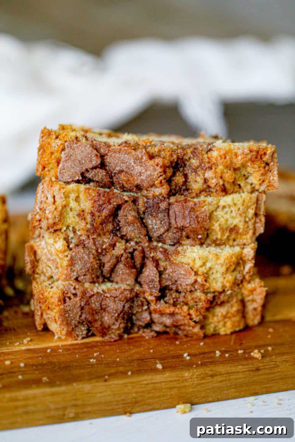 Amish Friendship Cinnamon Swirl Delight 2 Irresistible Amish Friendship Cinnamon Bread, sliced to show the cinnamon swirl and crunchy topping.