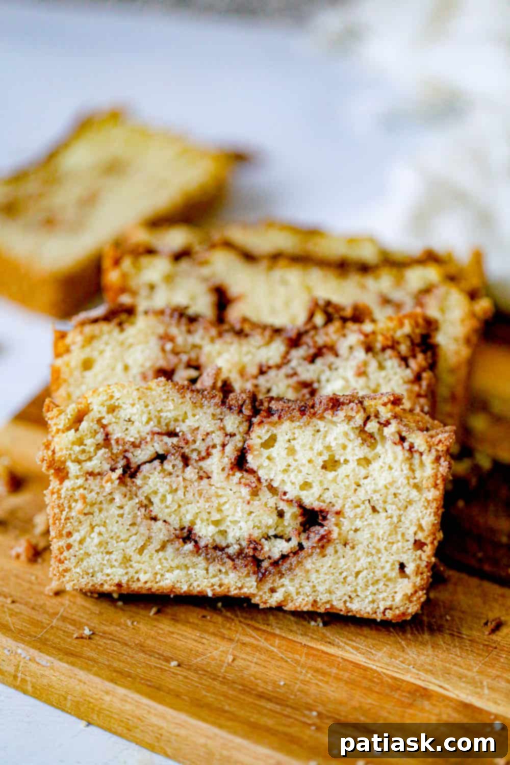 Amish Friendship Cinnamon Swirl Delight 3 A freshly baked loaf of Amish starter Bread, golden brown with a visible cinnamon swirl.