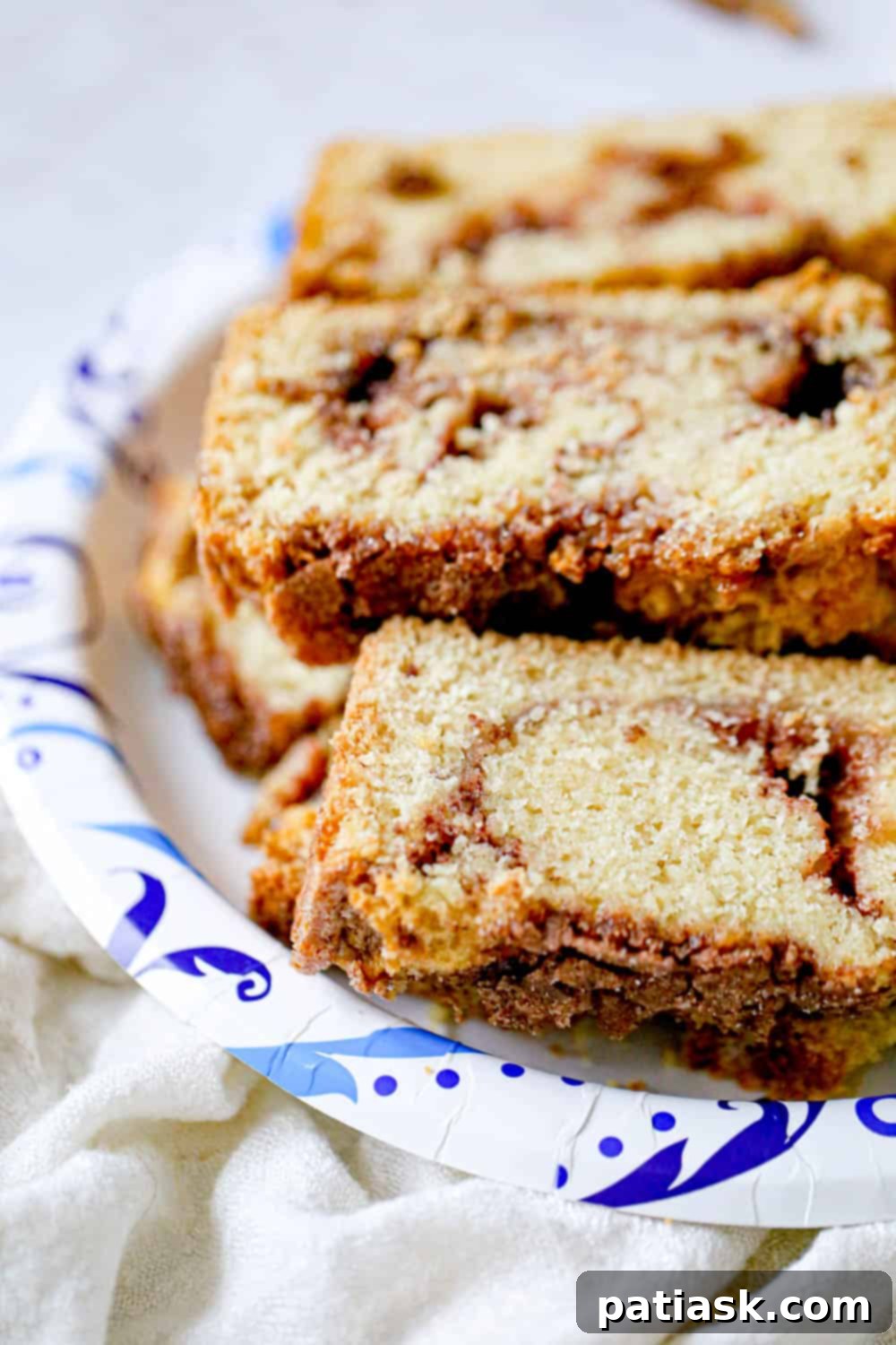 Amish Friendship Cinnamon Swirl Delight 4 A bowl of ingredients for Amish cinnamon friendship bread recipe without starter, featuring buttermilk and spices.