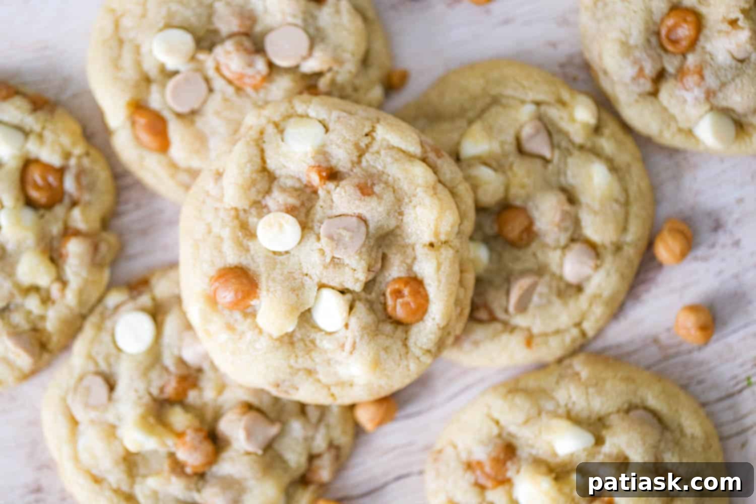 Sweet & Salty White Chocolate Caramel Gems 9 Baked Salted Caramel White Chocolate Cookies presented on a wooden cutting board
