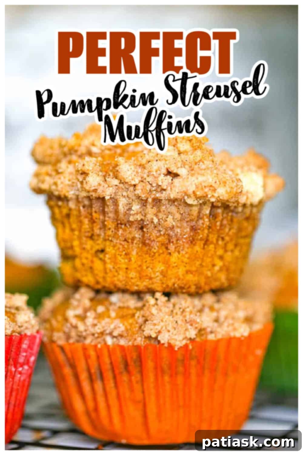 Spiced Pumpkin Crumble Muffins 7 A inviting stack of pumpkin streusel muffins on a rustic wooden board, emphasizing their fluffy texture and readiness to be enjoyed.