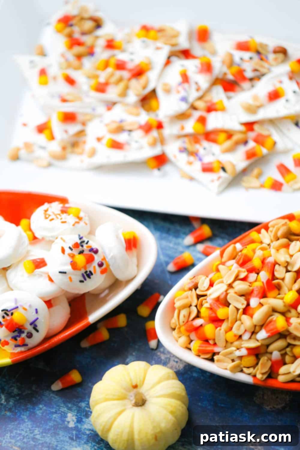 Candy corn bark in a festive bowl with a Halloween theme