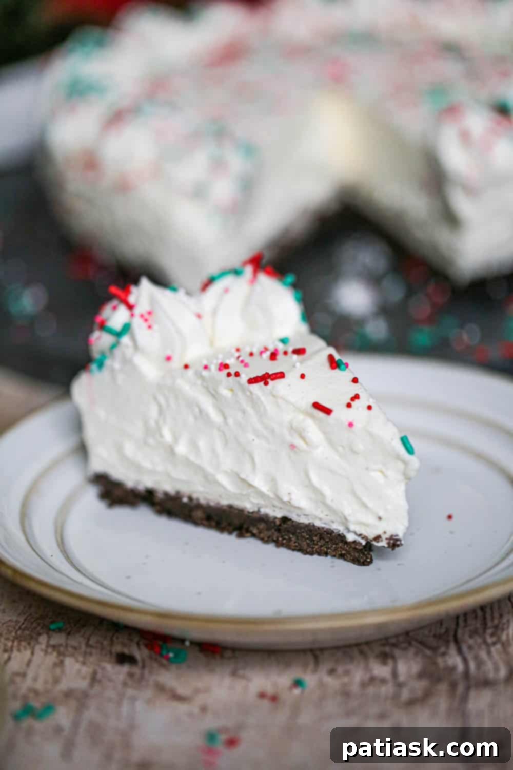 Simple Spiced Eggnog Cheesecake 3 Slice of festive eggnog cheesecake with a creamy filling