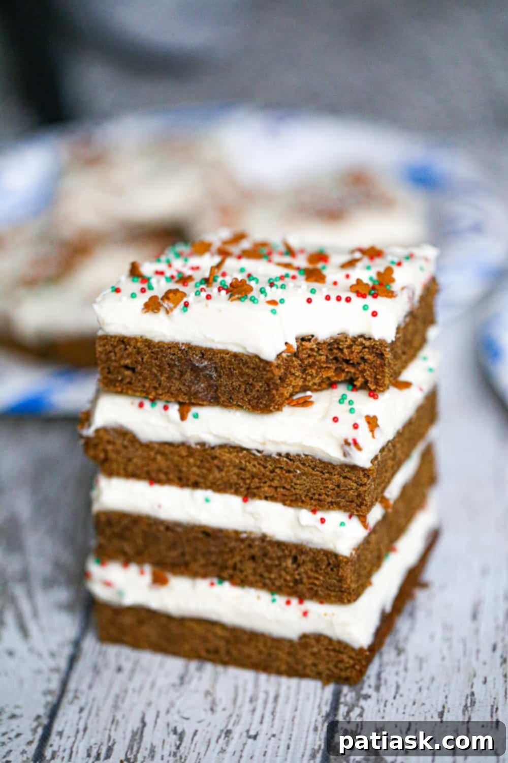 Spiced Gingerbread Bars 6 Close-up of gingerbread cookie bars with lemon-infused cream cheese frosting and sprinkles