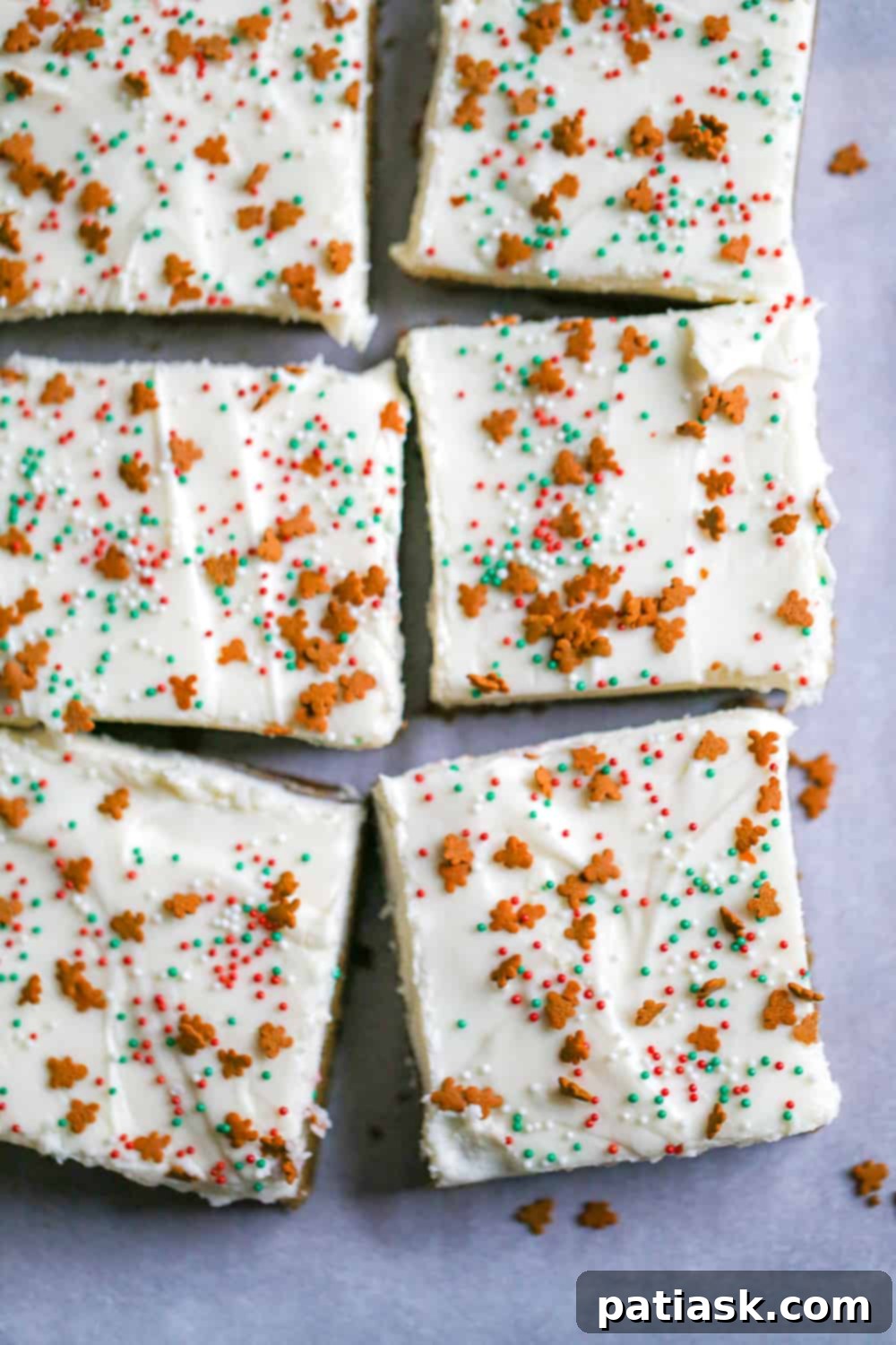 Spiced Gingerbread Bars 4 Gingerbread Cookie Bars with cream cheese frosting, garnished with festive sprinkles