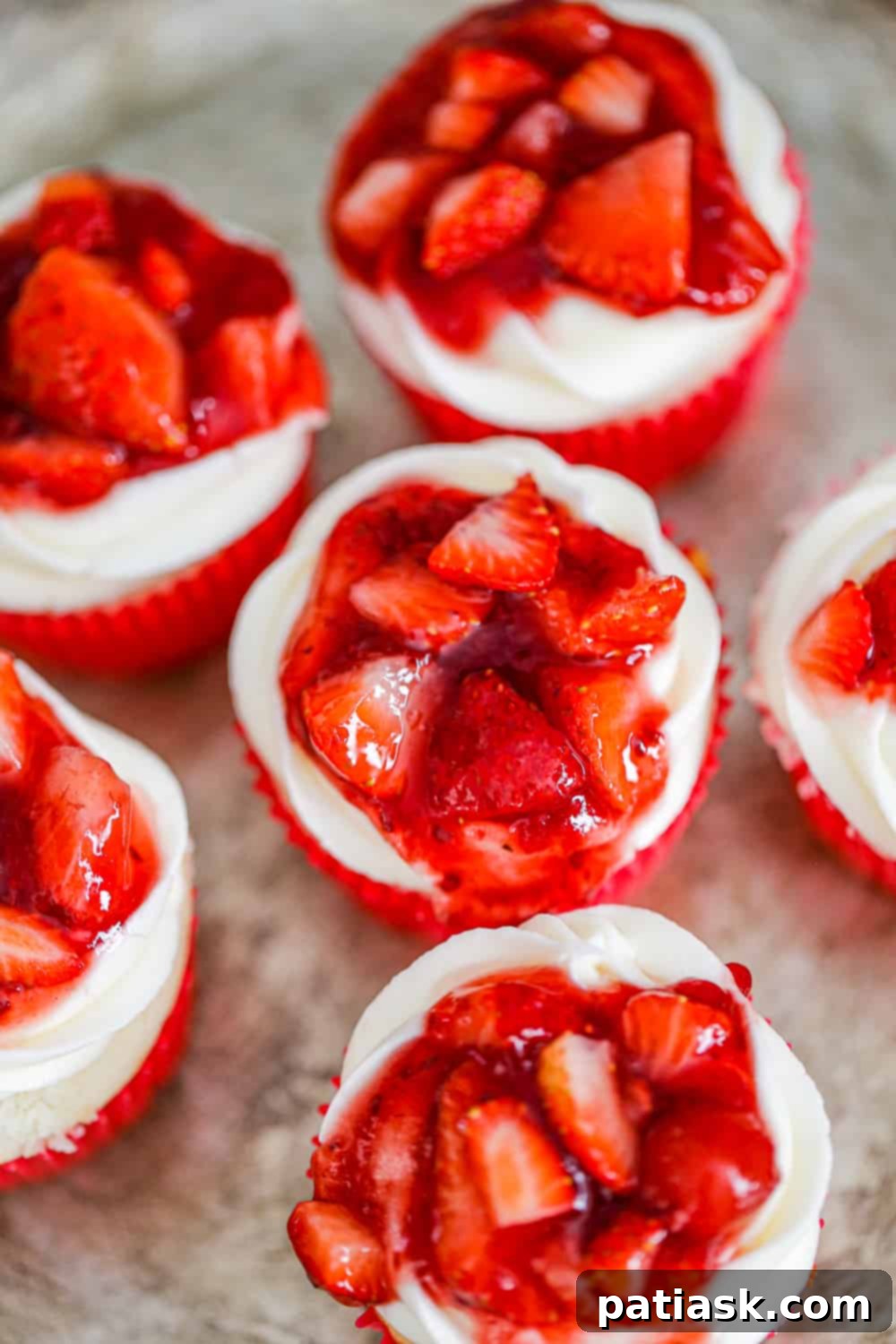 Strawberry Shortcake Cupcakes Made Simple 4 A tray of freshly baked Strawberry Shortcake Cupcakes, ready for serving.