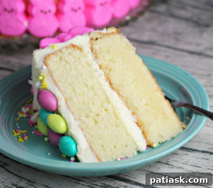 A close-up side view of the Easter Bunny Cake, showing the marshmallow bunnies along the edge