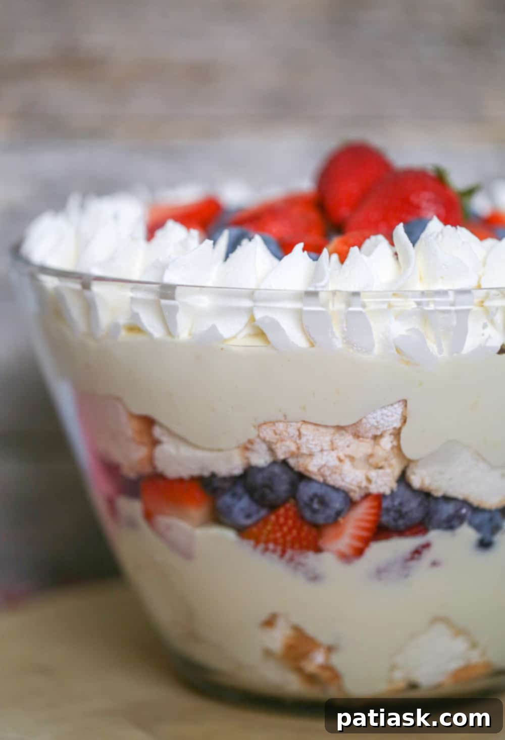 Delicious Easy Berry Trifle with layers of angel food cake, berries, pudding, and whipped cream, perfect for summer.